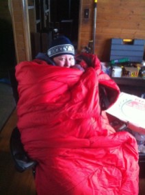 Janeé wrapped in a sleeping bag